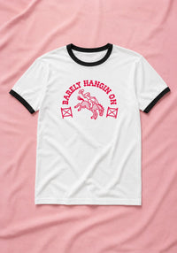 Barely Hangin' On Ringer Tee by kaeraz cowgirl desert horse